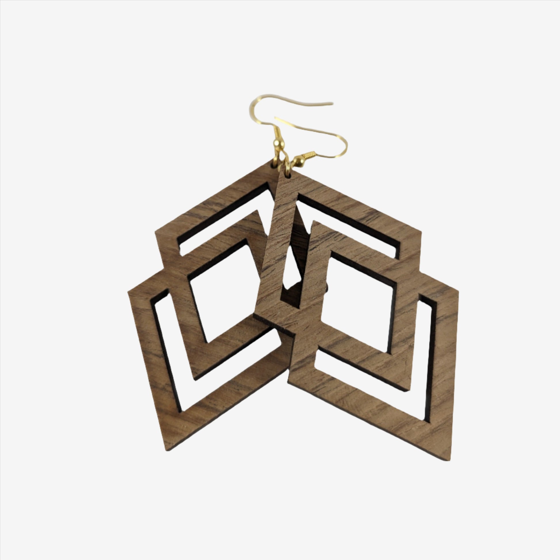 Handcrafted teak earrings featuring intricate laser-engraved designs, showcasing natural wood grain and artistic detailing. They feature a beautiful diamond design.