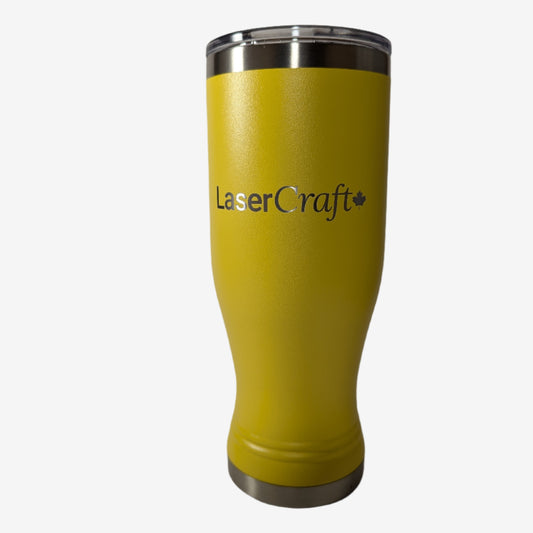 A yellow stainless steel pilsner cup with custom laser engraving displayed. The pilsner cup is sleek and functional, featuring precise, silver-colored engravings along its surface, showcasing the personalization option available.